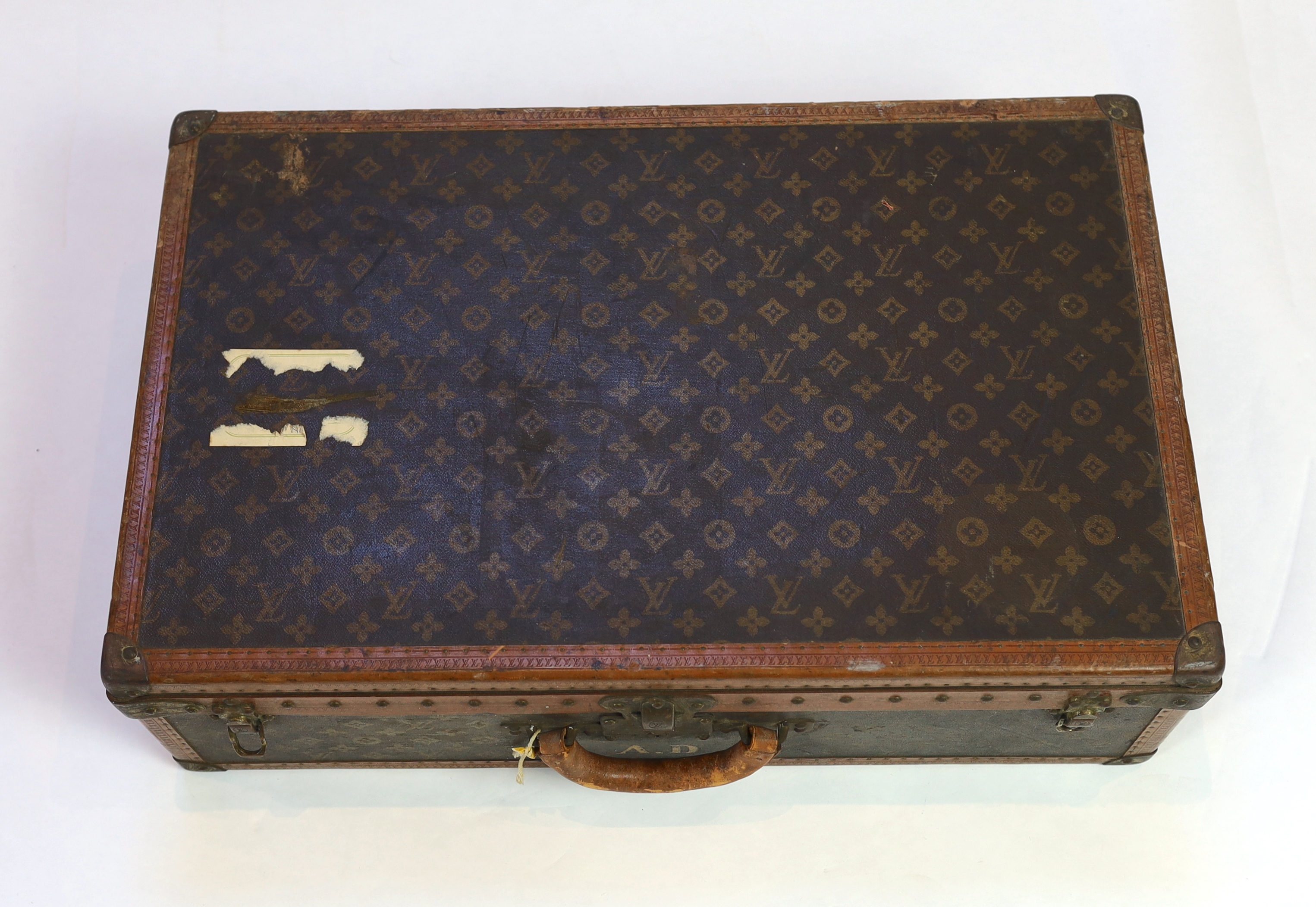 A vintage Louis Vuitton suitcase with monogram canvas and tan leather, width 71cm, height 44cm, depth 22cm